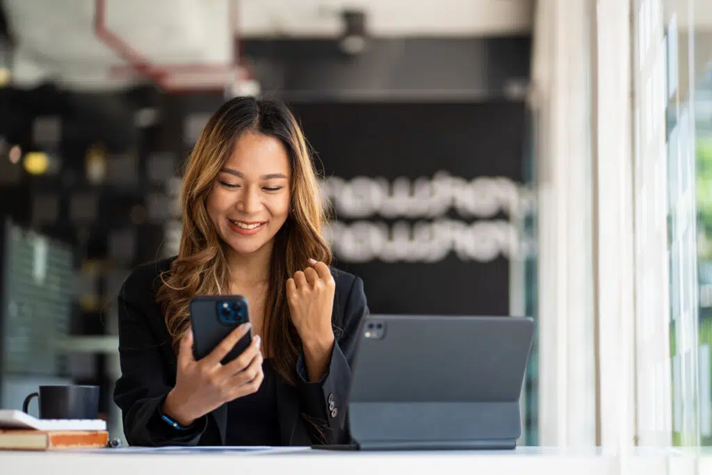 Woman smiling at phone