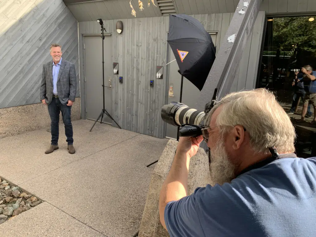 Videographer capturing businessman