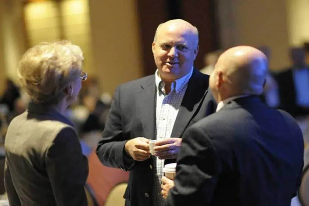 KB Woods' CEO Keith Woods at an event talking with people