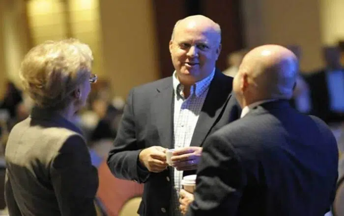 KB Woods' CEO Keith Woods at an event talking with people